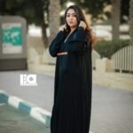 Black Pleated Belted Abaya - Women's black modest Islamic dress with pleated hem details and contrasting brown leather belt