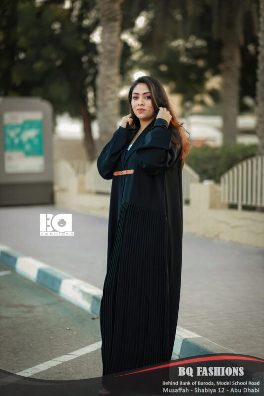 Black Pleated Belted Abaya - Women's black modest Islamic dress with pleated hem details and contrasting brown leather belt