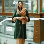 Green and Tan Button-Front Overcoat Abaya - Women's emerald green overcoat with tan base modest Islamic dress featuring button details